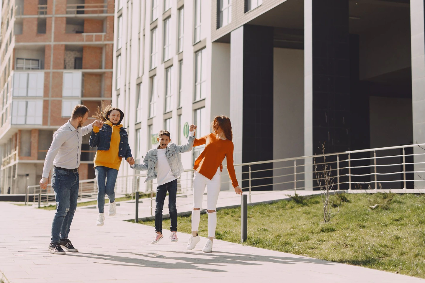 Family walking together through a residential neighborhood